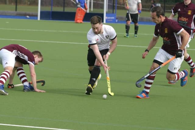 Zac Chinn (centre) in action for Horsham.