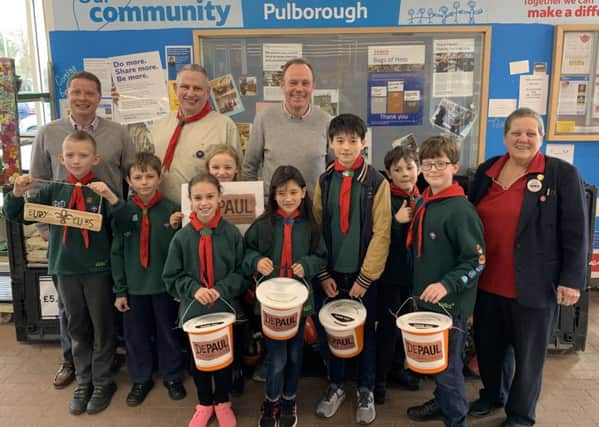 Jason Eades, Jonathan Pearce, Nick Herbert, Karen Brooks, Community Champion for Tesco Pulborough, and members of the Bury and Pulborough cub packs.