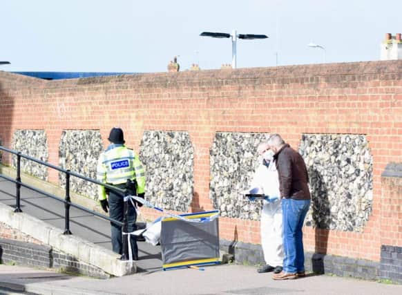 Police at the footbridge, which has been cordoned off. Picture by Dan Jessup SUS-190903-111548001