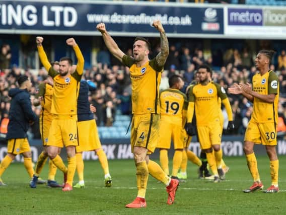 Brighton players celebrate their win at Millwall yesterday. Picture by PW Sporting Photography