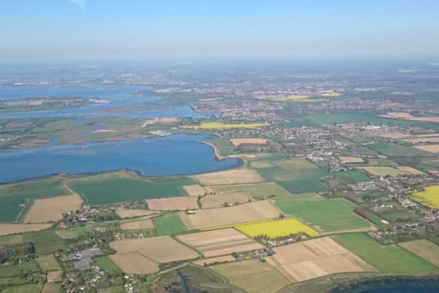 An aerial photograph of the top of Chichester Harbour and the A259 corridor