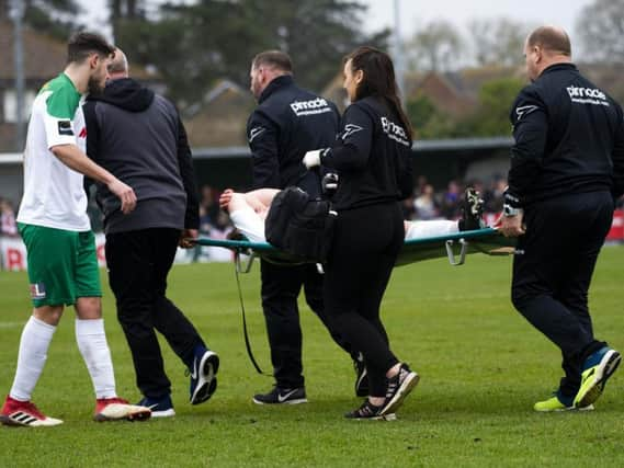 One of the Rocks' recent casualties was Calvin Davies, seen here being carried off in the home match with Worthing / Picture by Tommy McMillan