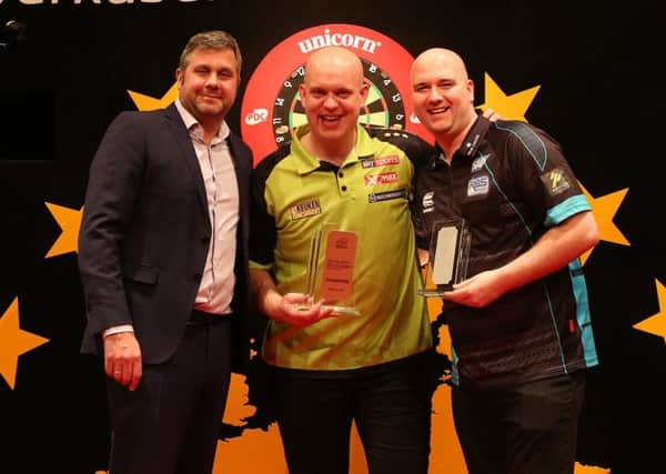 European Open runner-up Rob Cross (right) alongside winner Michael van Gerwen (centre) after the final in Leverkusen. Picture courtesy Sven Neuschäfer/PDC Europe