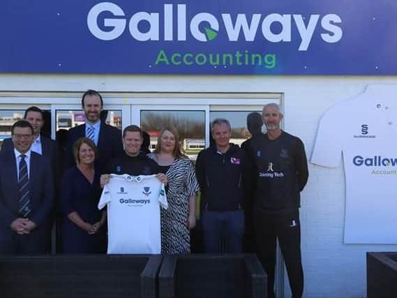 From left, Rob Andrew (Sussex CEO), Tom Bowen (Galloways), Alastair Hallows (Galloways), Lorna Sizer (Galloways), Ben Brown (Sussex Cricket captain), Gemma Gaines (Galloways), Matt Rourke (Galloways) & Jason Gillespie (Sussex head coach) with Sussex's new Specsavers County Championship shirt in front of the Galloways box / Picture: Sussex Cricket