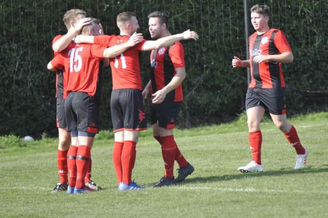 Rustington celebrate the first goal