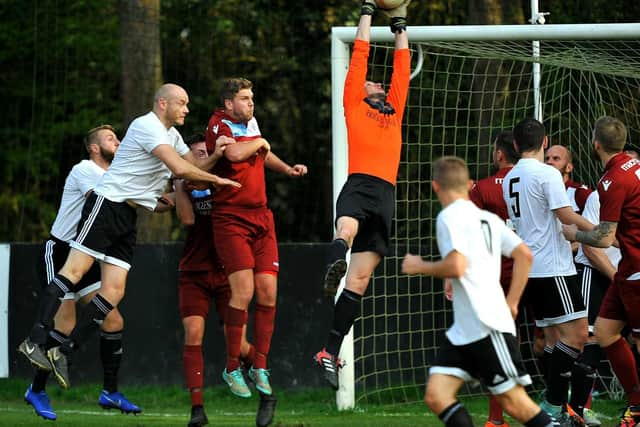 Loxwood put Little Common keeper Matt Cruttwell under pressure.