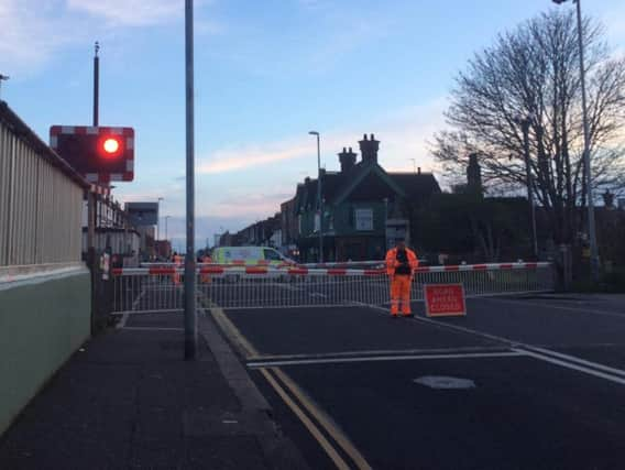 The railway line crosses Station Road, Portslade