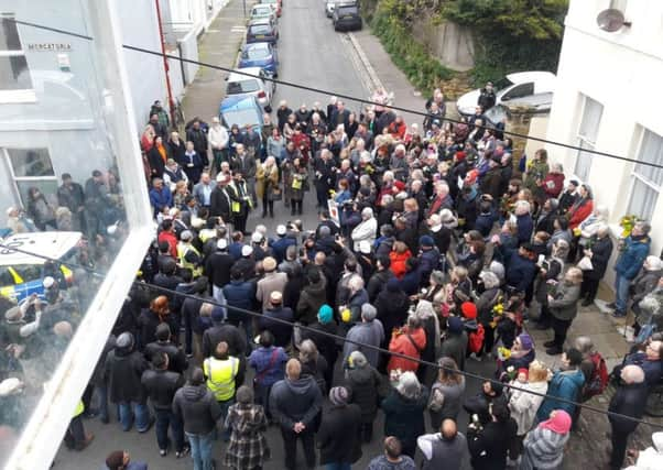 The vigil at Hastings mosque. SUS-190322-153056001