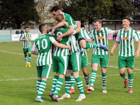 City celebrate one of the goals that clinched a 2-0 win over Langney - and the title / Picture by Kate Shemilt