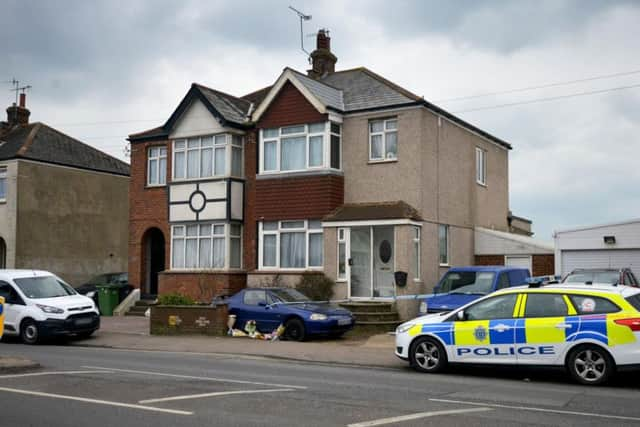 Flowers left outside the house a day after the shooting