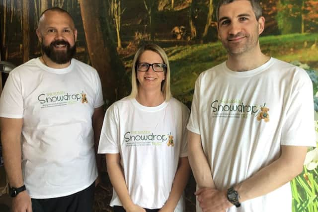 Marathon runners Leon Robinson, Karen Spencer and Dean Yeoman are supporter The Sussex Snowdrop Trust