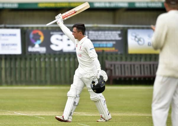 Horsham CC's Tom Haines celebrates is century against Eastbourne at The Saffrons (Photo by Jon Rigby) SUS-180618-114237008