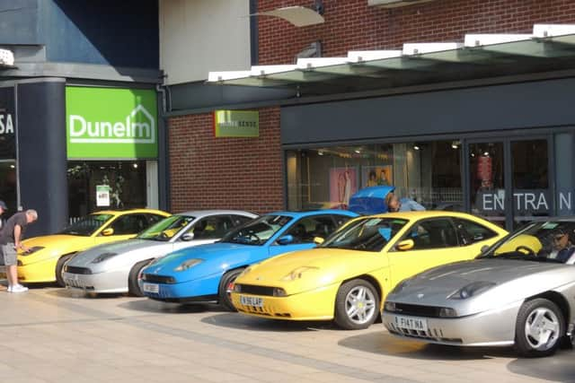 Cars line up in the Forum