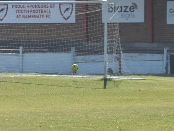 Kenny Pogue watches as his shot hits the post.