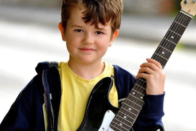 Charlie Bone with his guitar. Picture by Steve Robards