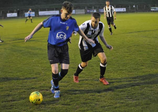 Action from the Hastings & District FA Intermediate Cup final between Sedlescombe Rangers (blue kit - Kasey Smith) and Robertsbridge United (white and black kit). Pictures by Simon Newstead