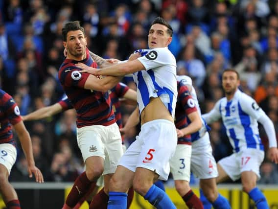 Lewis Dunk tussles for the ball in Brighton & Hove Albion's Premier League clash with Newcastle United this evening. All pictures by Steve Robards.