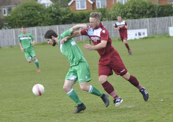 Jamie Crone, scorer of Little Common's winning goal, pressurises a Crawley Down Gatwick opponent. Picture by Simon Newstead