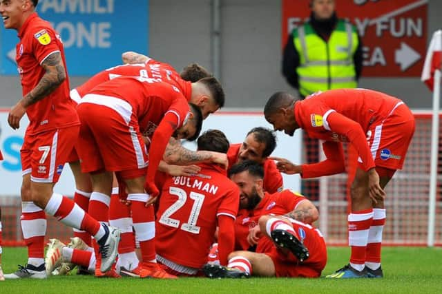 Dannie Bulman celebrates his strike against Forest Green