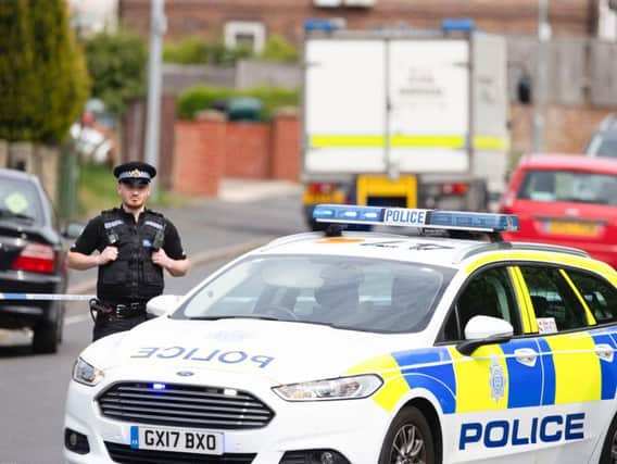 Police sealed off the road in Brighton after reports of a hand grenade found in a loft