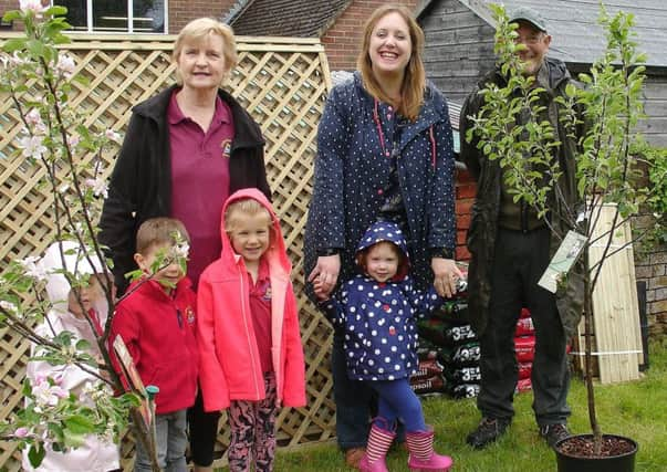 Clive Gravett is pictured with some of the delighted children from Chanctonbury Playschool, manager Suzanne Joyes and committee chair Ruth Parnell. SUS-190521-171009001