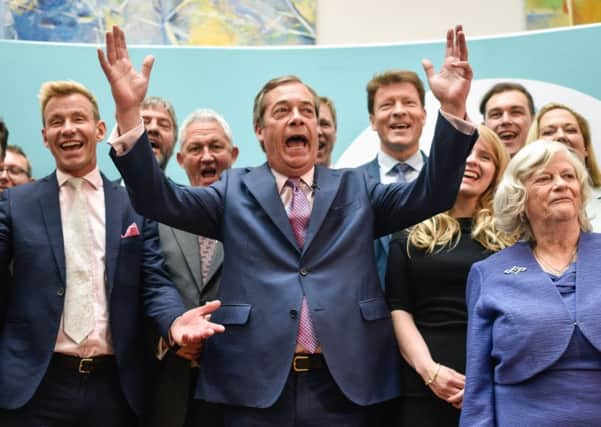 Brexit Party leader Nigel Farage speaks to the media as he stands with newly elected Brexit Party MEPs. (Photo by Peter Summers/Getty Images)