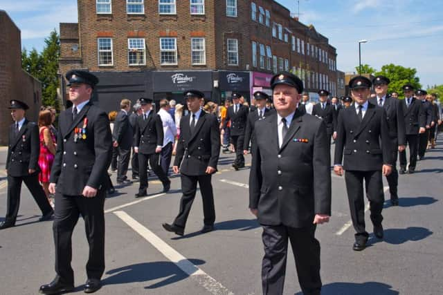 Mark's son, Adam leading the way at the funeral procession in Haywards Heath, proudly wearing his medals. Photo by Eddie Howland