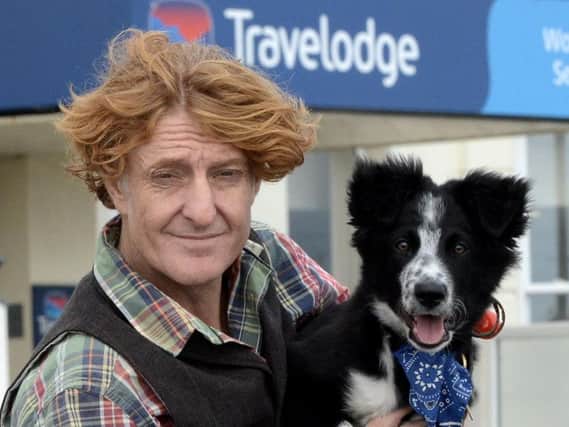 Tom Rowland with his puppy JB. Picture: Kate Shemilt