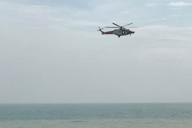 The coastguard helicopter is searching the water near the old bathing pool site