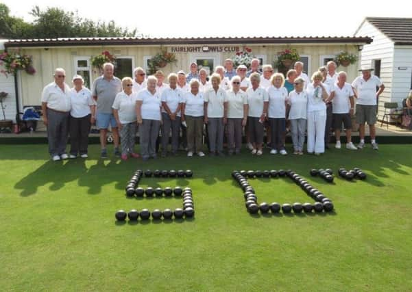 The Lads and Lasses bowlers in front of the Fairlight Bowls Club pavilion SUS-180908-225036002