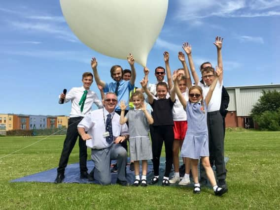 Two students and a teacher from Chatsmore Catholic High School in Goring Street, Worthing, have sent cameras into space