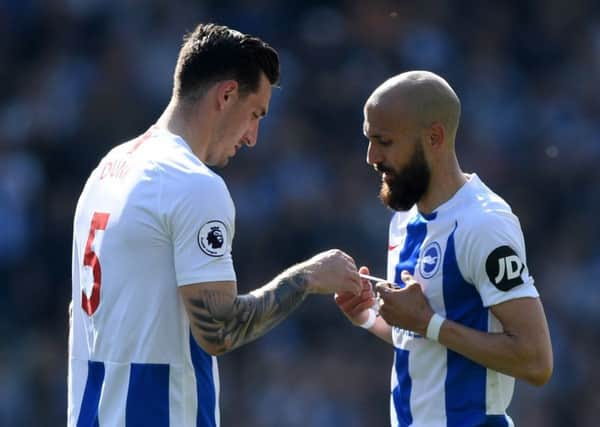 Bruno hands Lewis Dunk the armband last season