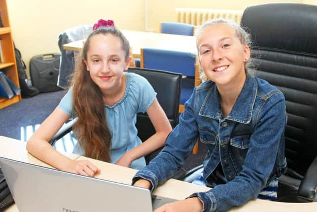 Pupils take over as head teacher and deputy head teacher for the day at Thomas A'Becket Junior School in Worthing. Photo by Derek Martin DM1970017a