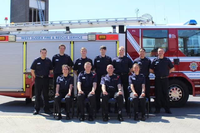 The nine new retained firefighters with their training instructors at Worthing Fire Station