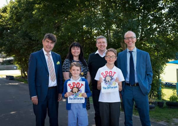 Newberry Tully Estate Agents teamed up with author Jerry Lyons to donate the books. Photo by Matt Bode Photography