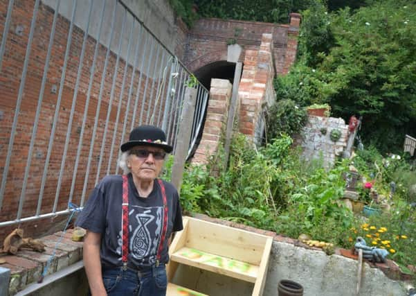 Jasper Barnard pictured in his back garden next to West Hill Lift