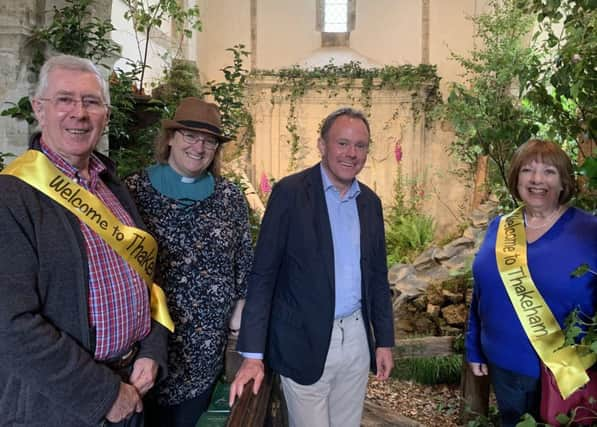 Nick Herbert with St Marys Reverend Sara-Jane Stevens and flower festival volunteers SUS-190724-160334001