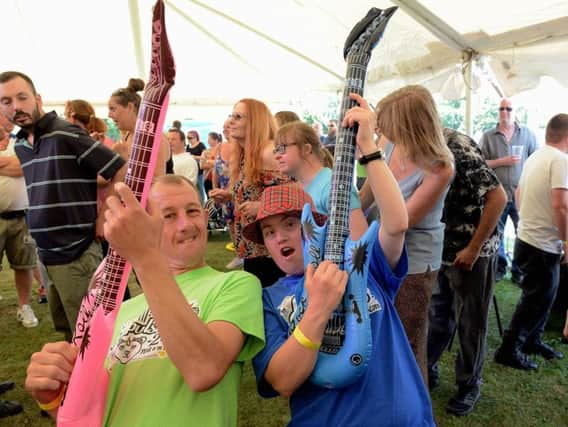 Two music lovers rock out at the festival. Picture by Kate Shemilt