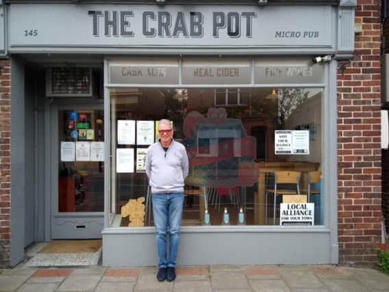 Owner at Edward Sye outside the original premises