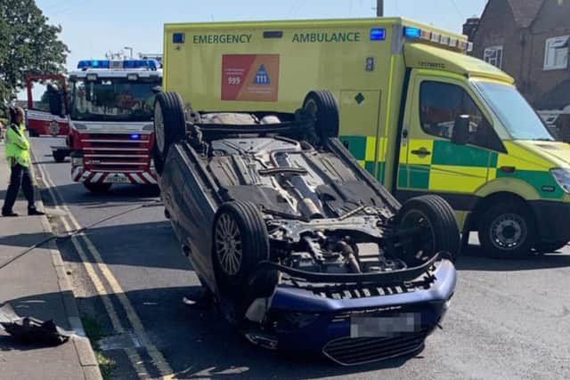 A car has rolled over in Shoreham