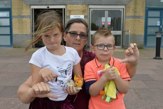 Stephanie Jones with her children Grace (7) and Clark (4) outside the Sovereign Centre in Eastbourne (Photo by Jon Rigby) SUS-190209-141808008