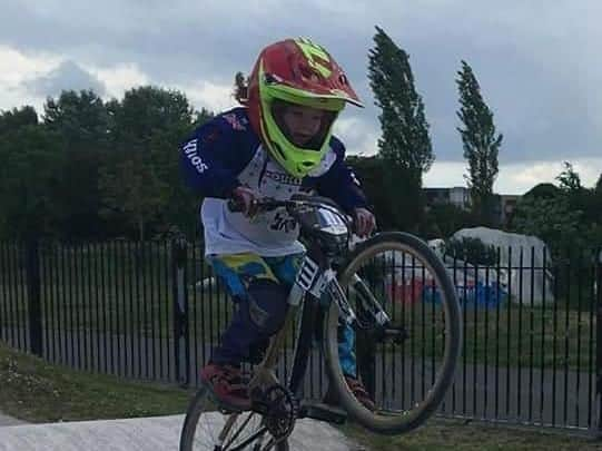 Poppy on track on her bike