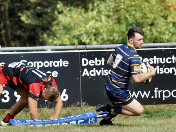 Sam Boyland forces his way over against Old Redcliffians. Picture by Stephen Goodger