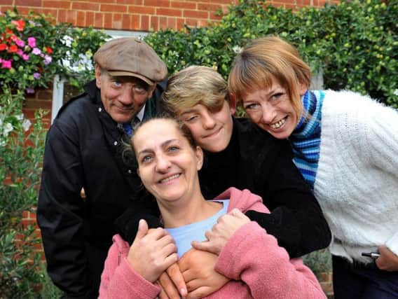 Jim Vowels, left, who first called for Miles to be praised, with Miles, Kellie and Louise (centre, front). SR09091901 (28)