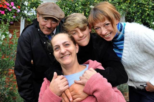 Jim Vowels, left, who first called for Miles to be praised, with Miles, Kellie and Louise (centre, front). SR09091901 (28)