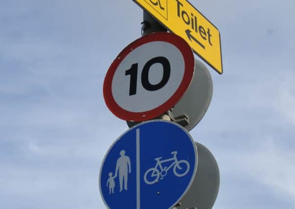 Speed limit and cyclist and pedestrian signs at  Fisherman's Green Eastbourne. February 26th 2014 E08112Q SUS-140227-131721001