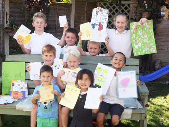 DM1992636a.jpg. Pupils at Billingshurst Primary School are hoping lollipop man John Gooderham will recover soon after a crash outside the school that left him with broken ribs. Photo by Derek Martin Photography.