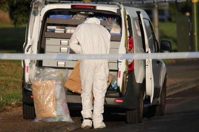 A forensics investigator at the scene in Littlehampton