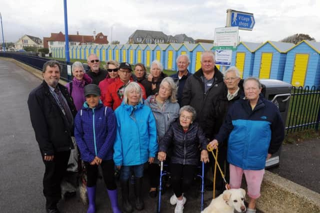 Residents and councillors calling for railings at the Felpham beach huts to be removed