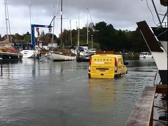 Van driving through water in Birdham  Pool